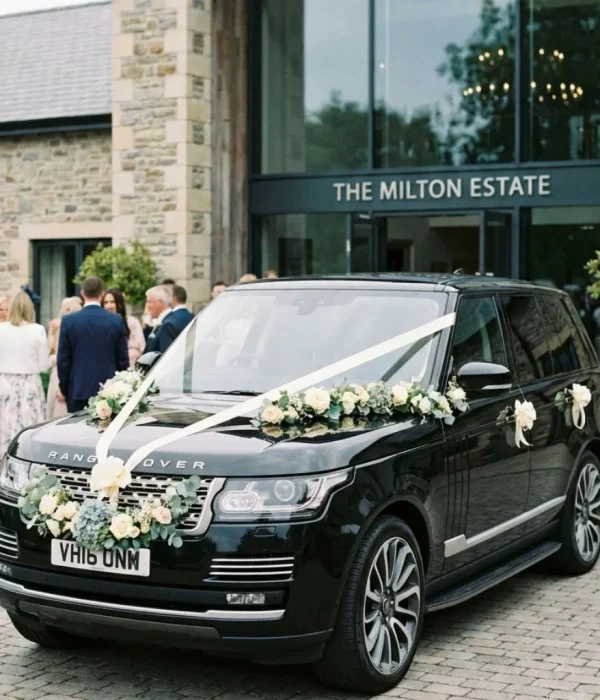 Wedding Limo Service Milton with luxury black sedan SUV decorated for wedding outside venue